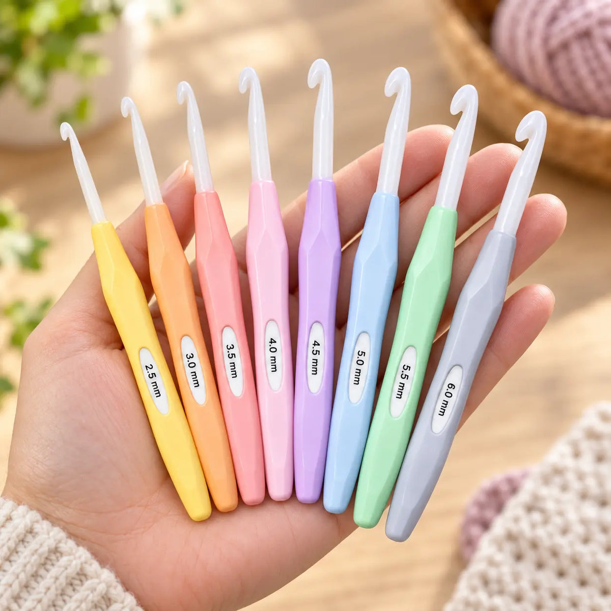 Complete 8-piece pastel inline crochet hook set shown at hand scale