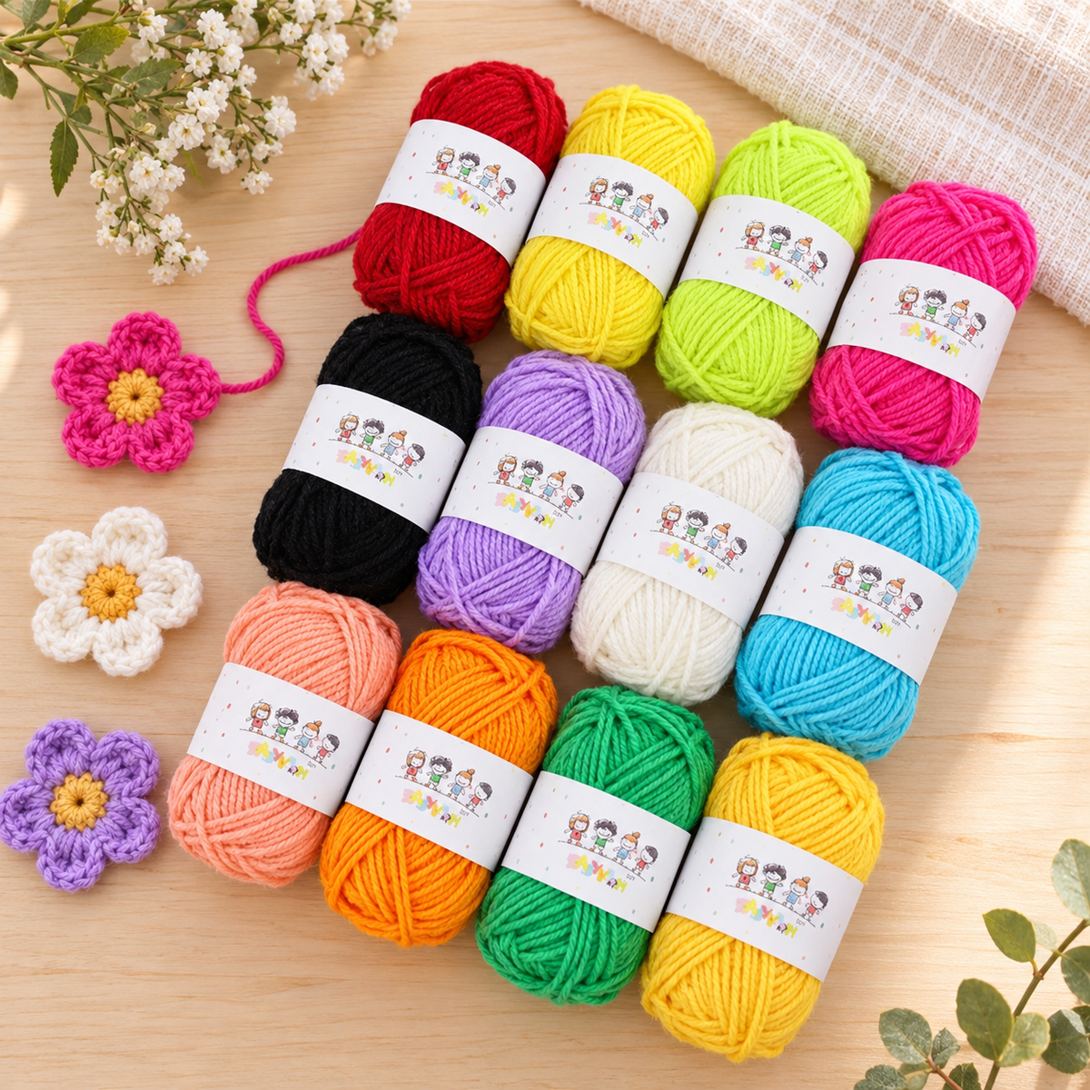 Twelve-colour mini acrylic yarn set beside small crochet flower examples; flowers not included