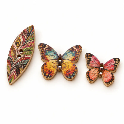 Macro comparison of one leaf-shaped and two butterfly-shaped two-hole wooden button variants