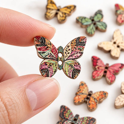 Small butterfly-shaped two-hole wooden button held between fingertips