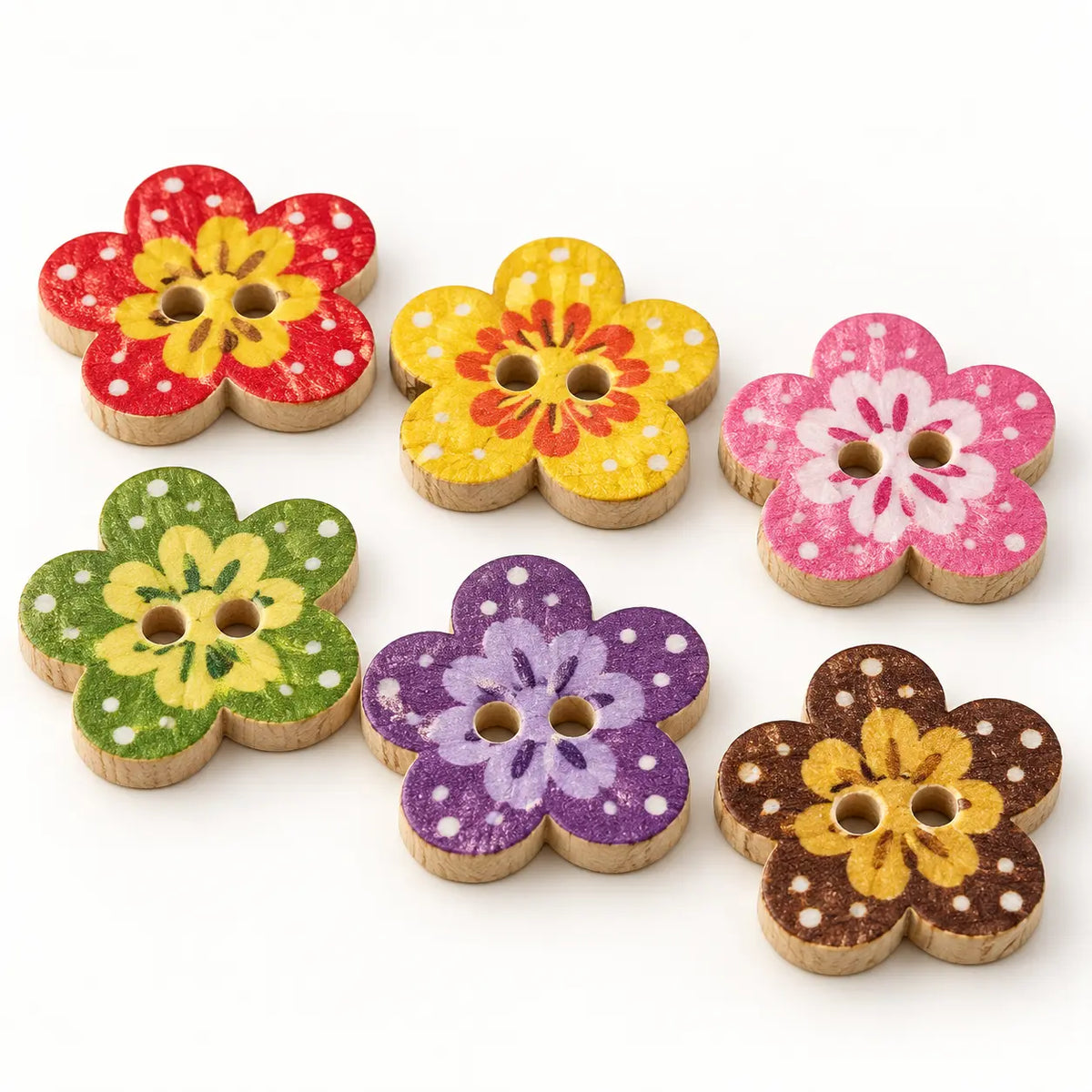 Macro view of colorful flower-shaped wooden buttons showing two holes and wood edges