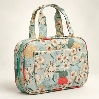 Floral crochet hook organizer case closed on a warm ivory background