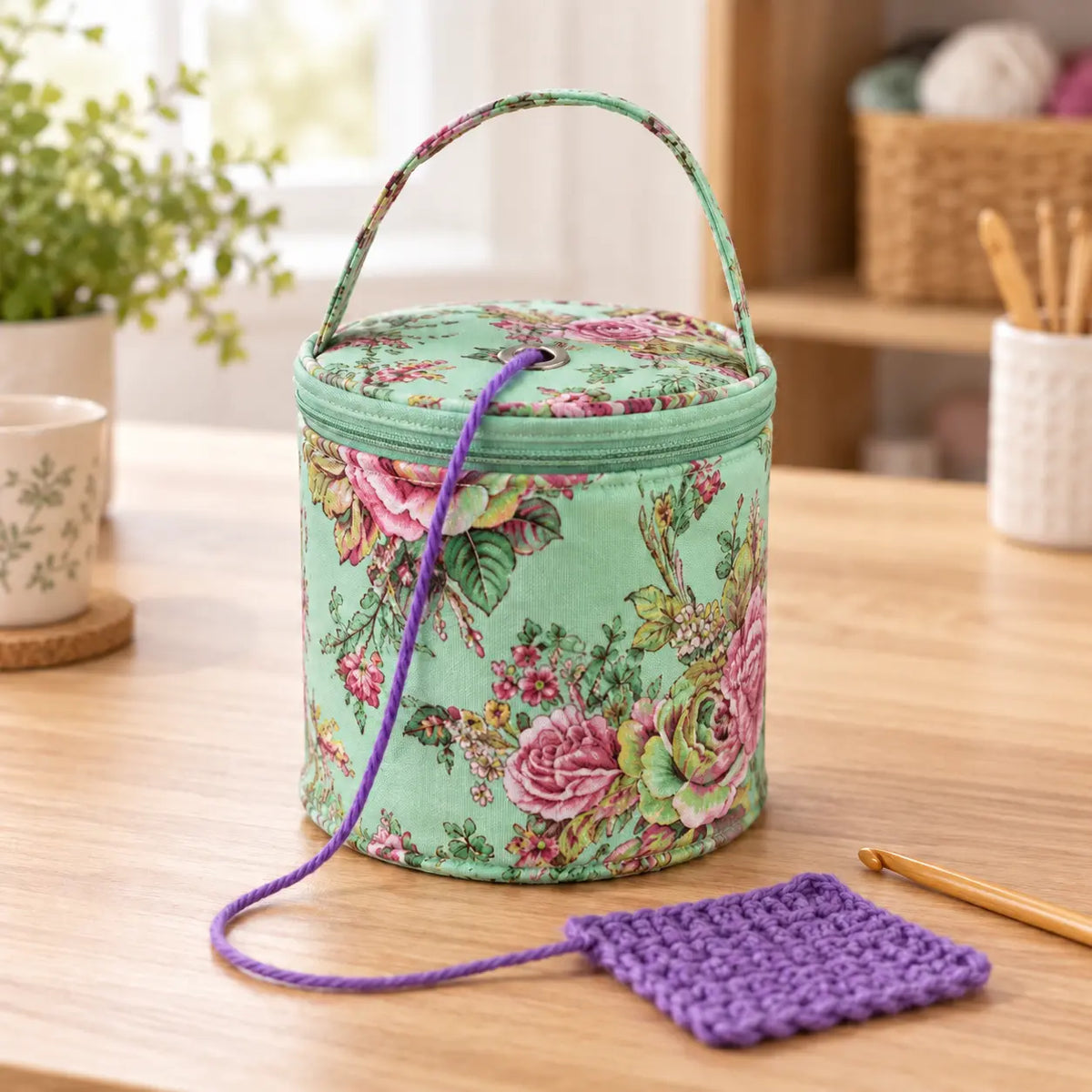 Green Peonies round yarn tote feeding yarn through the lid eyelet; yarn and hook not included